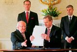 thumbnail: General to the President Art O'Leary (back left) and Secretary General at the Department of the Taoiseach, Martin Fraser (back right) watch as Taoiseach Enda Kenny (right) and President Michael D Higgins sign an order dissolving the Irish Parliament and starting the 2016 general election campaign at Aras an Uachtarain. Photo: Niall Carson/PA Wire