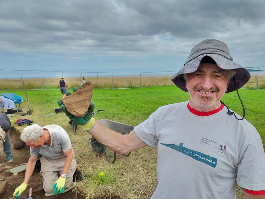 Volunteer Brian with a sherd of Roman amphora. Pic: Christine Baker