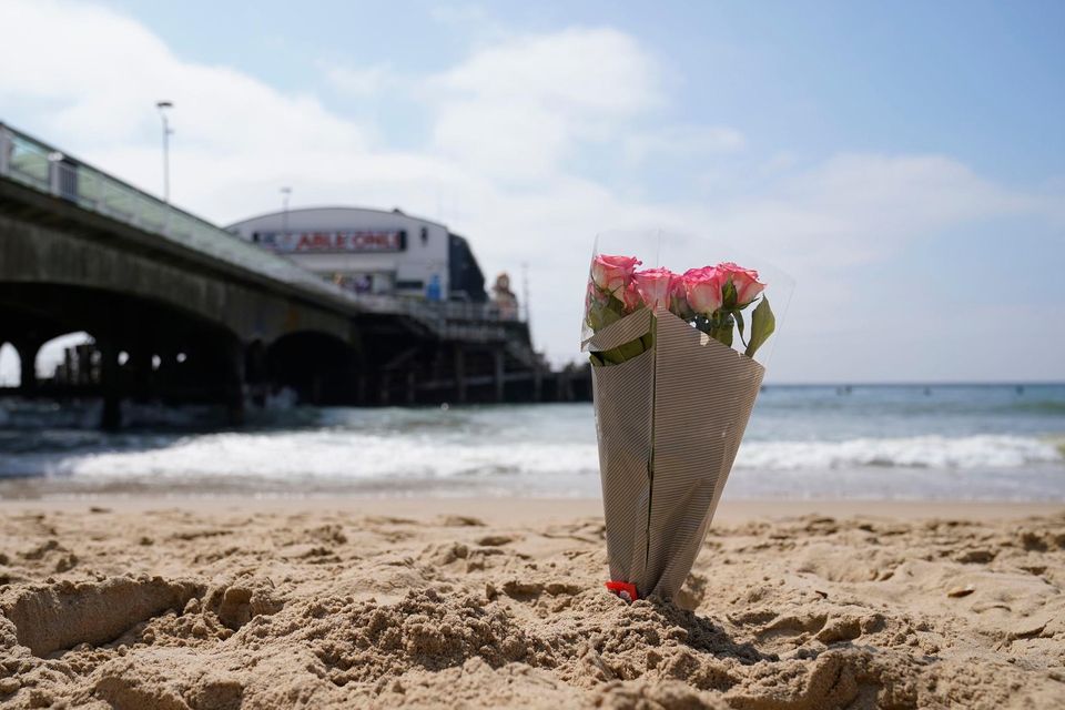 A bunch of flowers left on Bournemouth beach. Photo: Andrew Matthews/PA Wire