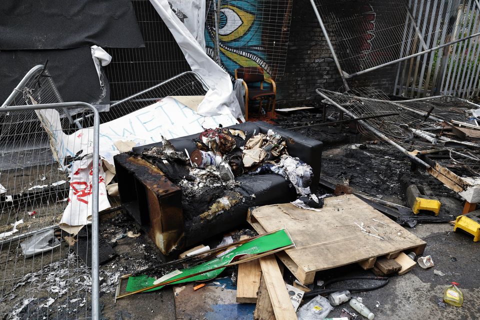 The burnt remains of an encampment used by asylum-seekers, at Sandwith Street in Dublin, which was set alight following protests in the area. Photo: Conor Ó Mearáin/Collins Photo Agency