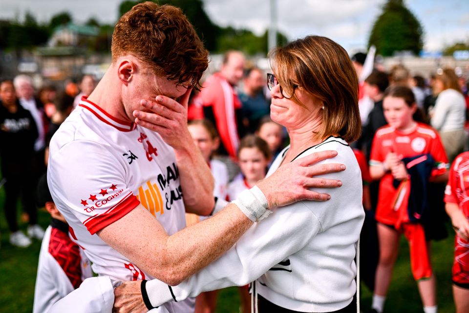 An emotional Conor Meyler of Tyrone is consoled by his mother Paula following his return to action after a 23 month absence due to injury in Enniskillen today. Photo: Ben McShane/Sportsfile