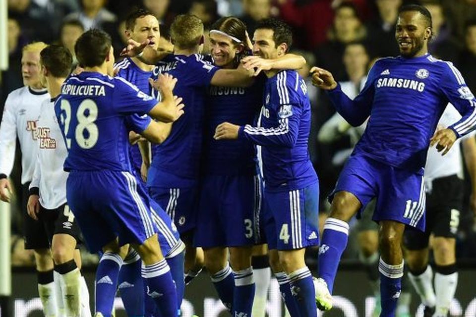Filipe Luis of Chelsea celebrates scoring his team's second goal during the Capital One Cup Quarter-Final against Derby County