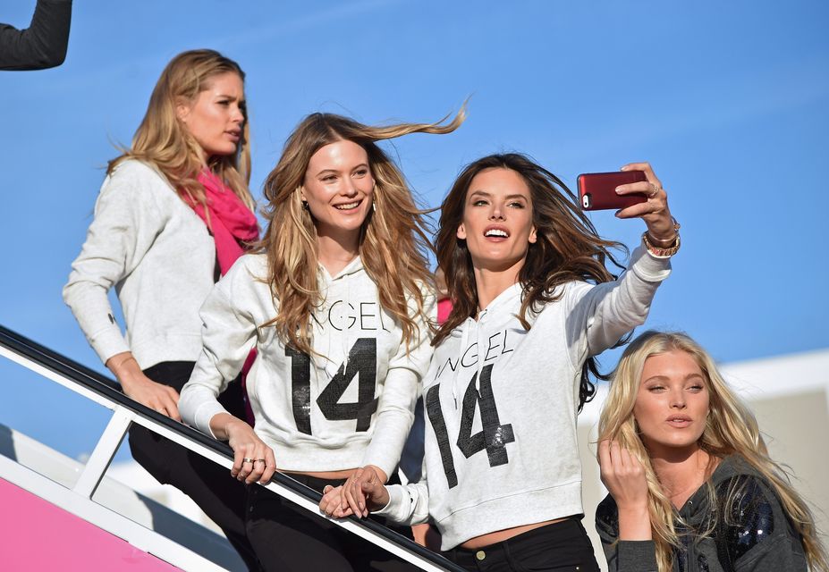 (L-R) Victoria's Secret Models Doutzen Kroes, Behati Prinsloo, Alessandra Ambrosio, and Lindsay Ellingson, depart for London for the 2014 Victoria's Secret Fashion Show at JFK Airport