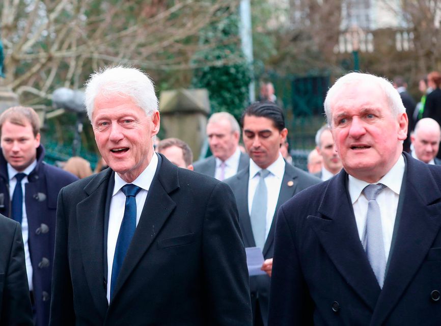 Former US President Bill Clinton (left) and former Taoiseach Bertie Ahern arriving for the funeral of Martin McGuinness. Photo: PA