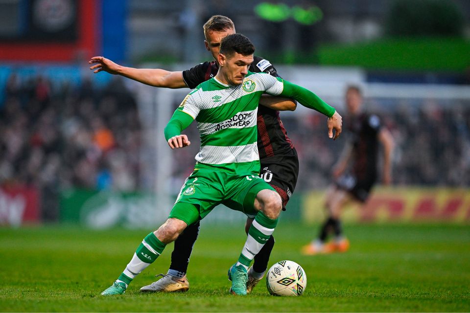 Trevor Clarke of Shamrock Rovers in action against Brian McManus of Bohemians
