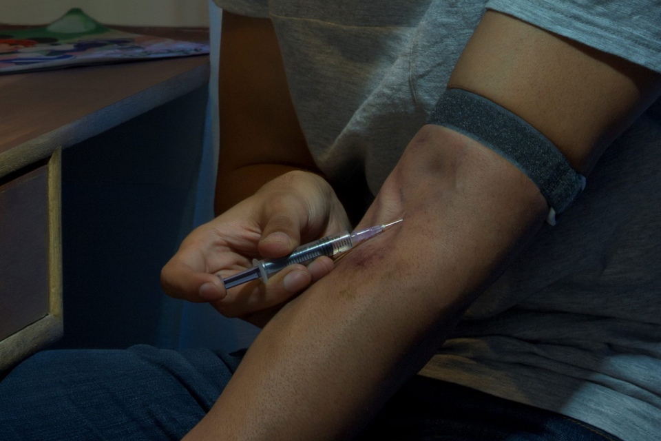 A heroin addict shoots up. Photo: Stock Image