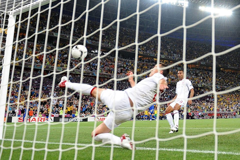 John Terry attempts to clear the ball off the line during the Euro 2012 Group D match. Photo: PA