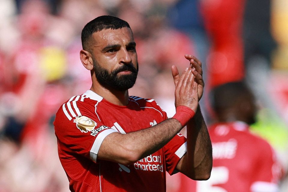 Liverpool's Mohamed Salah applauds fans as he walks off the pitch after being substituted with what appeared to be a hamstring injury (REUTERS/Phil Noble)