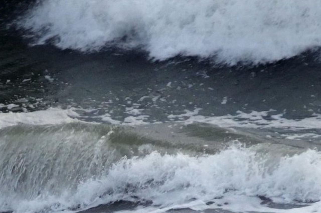 The science behind sea-foam green waves in stormy weather