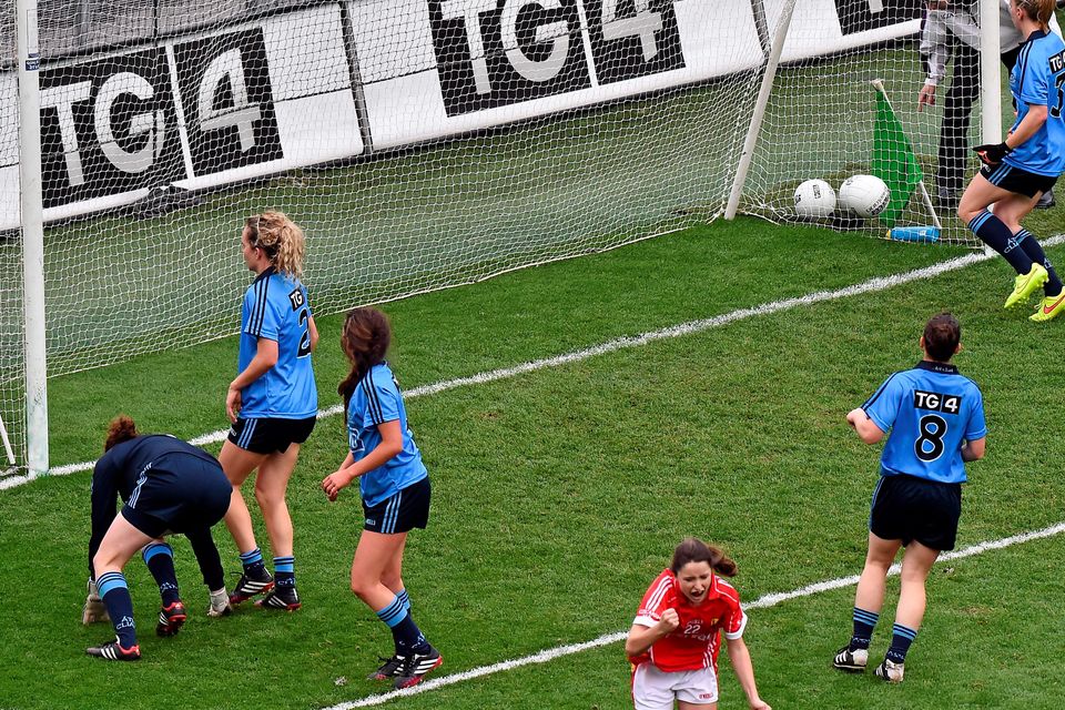 28 September 2014; Eimear Scally turns to celebrate after shooting past Dublin defenders Leah Caffrey, Rachel Ruddy and goalkeeper Clíodhna O'Connor to score a late goal for Cork. TG4 All-Ireland Ladies Football Senior Championship Final, Cork v Dublin. Croke Park, Dublin. Picture credit: Ray McManus / SPORTSFILE