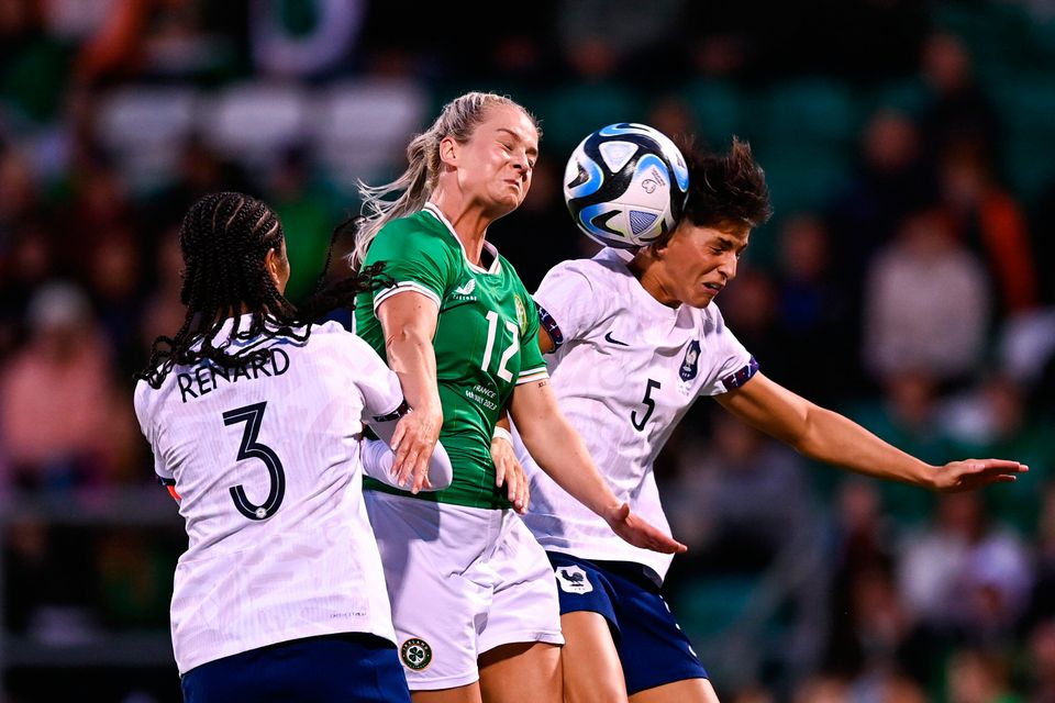 Ireland's Lily Agg in action against France's Wendie Renard and Elisa de Almeida during a friendly last July