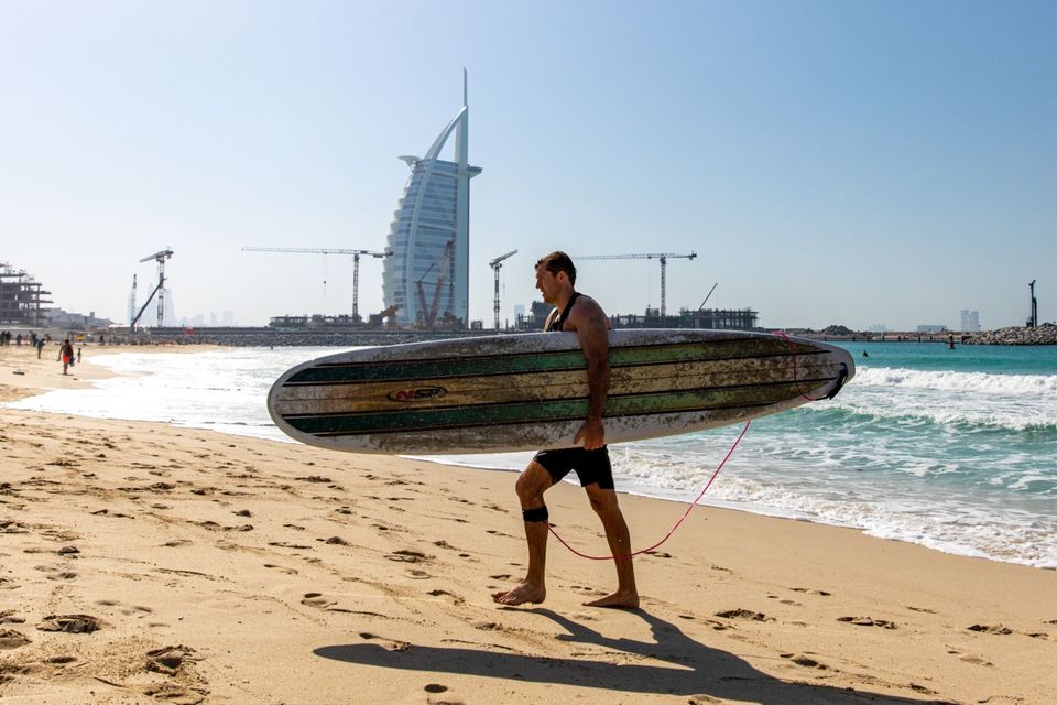 A tourist on Jumeirah beach in Dubai, United Arab Emirates. Picture by Christopher Pike/Bloomberg
