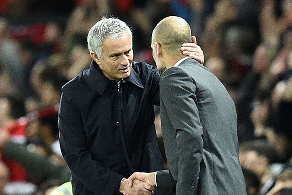 Manchester United's Portuguese manager Jose Mourinho (L) shakes hands with Manchester City's Spanish manager Pep Guardiola after the EFL (English Football League) Cup fourth round match between Manchester United and Manchester City at Old Trafford in Manchester, north west England on October 26, 2016.  AFP / Oli SCARFF