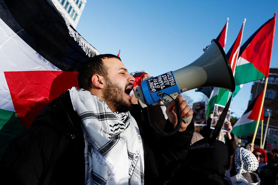 A pro-Palestine protester demonstrates outside the International Court of Justice in the Hague, Netherlands. Photo: Piroschka Van De Wouw