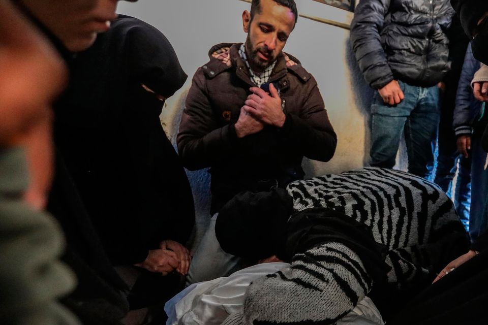 Family and friends in Rafah mourn another young person killed in the war. Photo: Getty