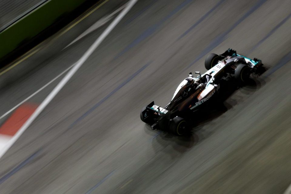 Lewis Hamilton drives during the first practice session of the Singapore F1 Grand Prix