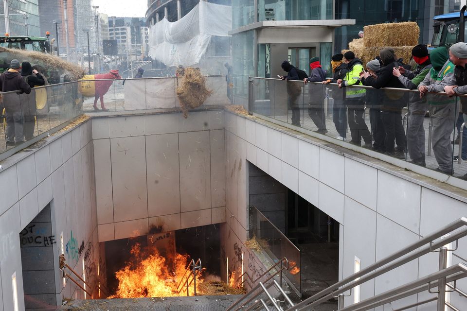 Belgian farmers set fire to straw during protests on the day of an EU agriculture ministers' meeting in Brussels, Belgium, over the weekend. Photo: Reuters/Yves Herman