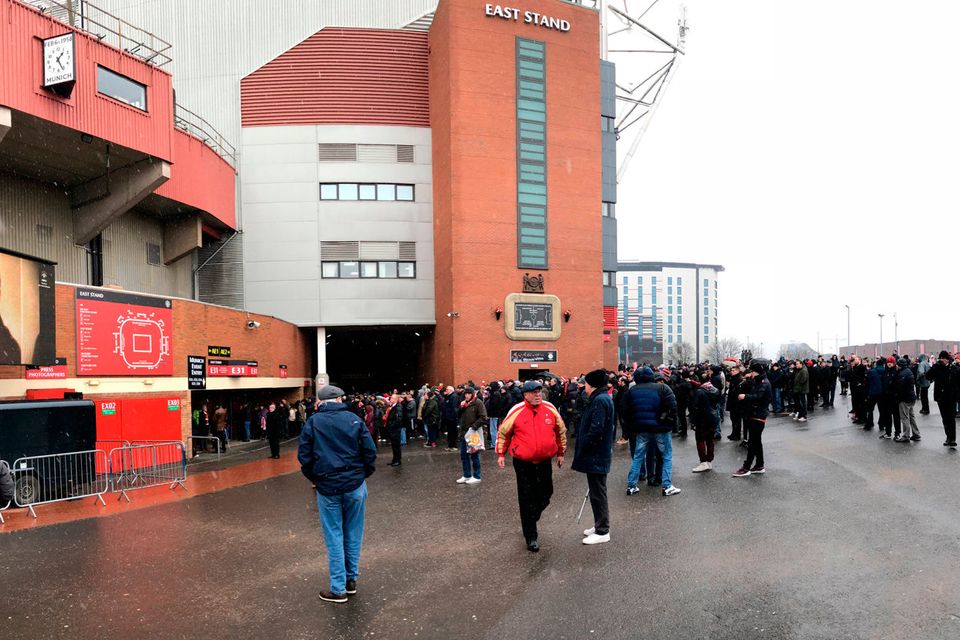 Fans arrive at Old Trafford in Manchester for the 60 Years Since The Munich Air Disaster commemorative ceremony. PRESS ASSOCIATION Photo. Picture date: Tuesday February 6, 2018. See PA story SOCCER Man Utd. Photo credit should read: Simon Peach/PA Wire.