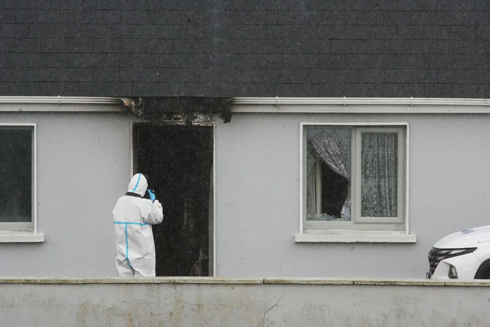 Scorch marks from a fire are seen at the house where John Brogan (83) was found dead on Sunday. Photo: Padraig O'Reilly