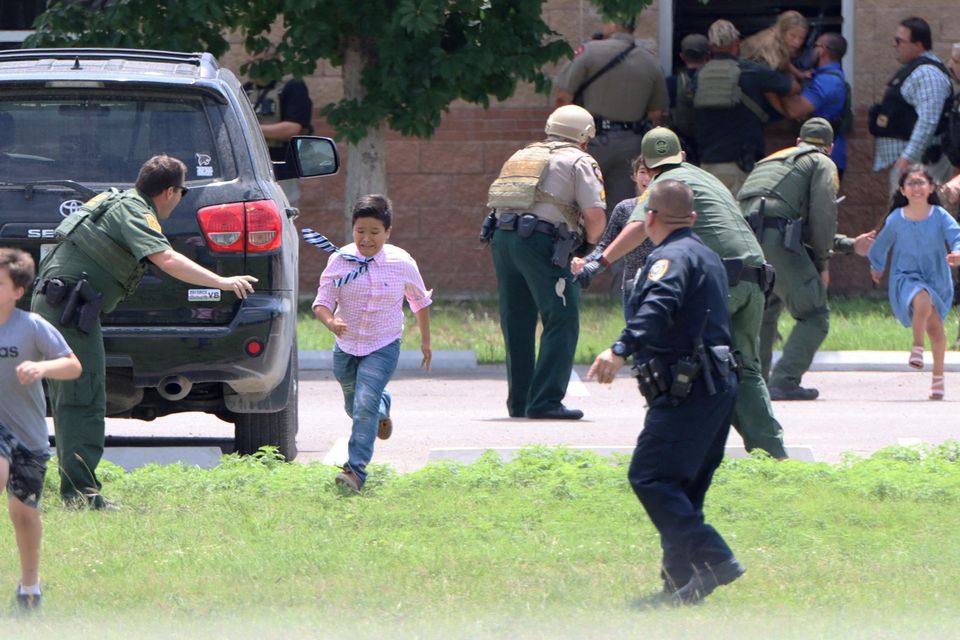 Children run to safety during a mass shooting at Robb Elementary School in Uvalde, Texas. Photo: Pete Luna/Uvalde Leader News via Reuters