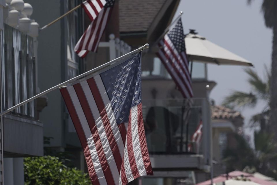 American flags on Independence Day. Photo: Bing Guan/Bloomberg