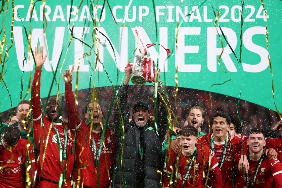 Liverpool manager Jurgen Klopp and Virgil van Dijk celebrate with the Carabao Cup trophy at Wembley Stadium, London