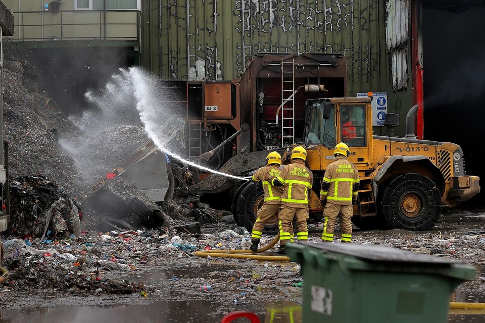 Dublin Fire Brigade members tackle a blaze at a recycling plant in the city earlier this year