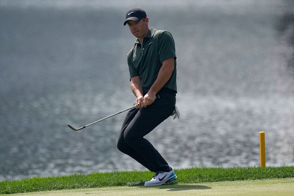 Rory McIlroy chips to the green on the 17th hole during the first round of the PGA Championship at Quail Hollow. Photo: David J Phillip/AP Photo