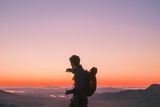 thumbnail: Marius Monaghan enjoys sunrise at Mount Errigal. Photo: Oisin Cooke