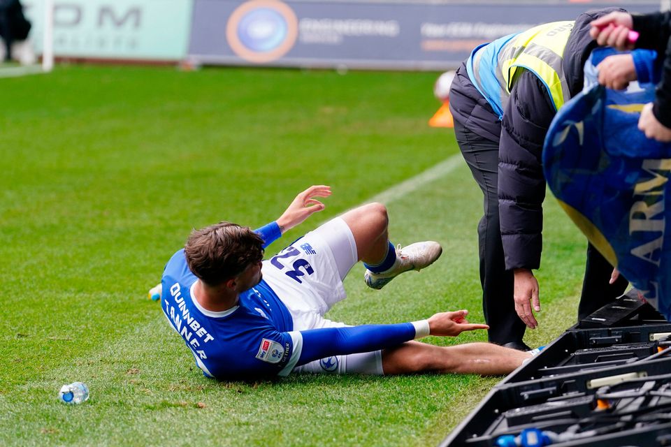 Cardiff City's Ollie Tanner gets his foot trapped under the board during the Sky Bet Championship match at the Swansea.com Stadium, Swansea. David Davies/PA Wire.