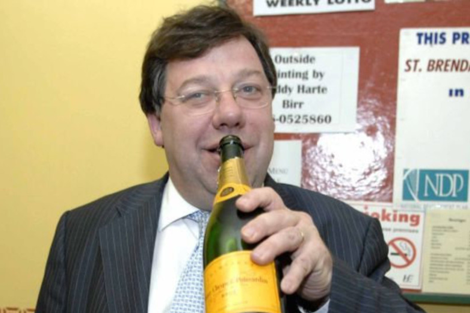 Cheers: Brian Cowen celebrates with champagne after winning his seat in the Offaly/Laois election count in May 2007. Photo: JAMES FLYNN/APX