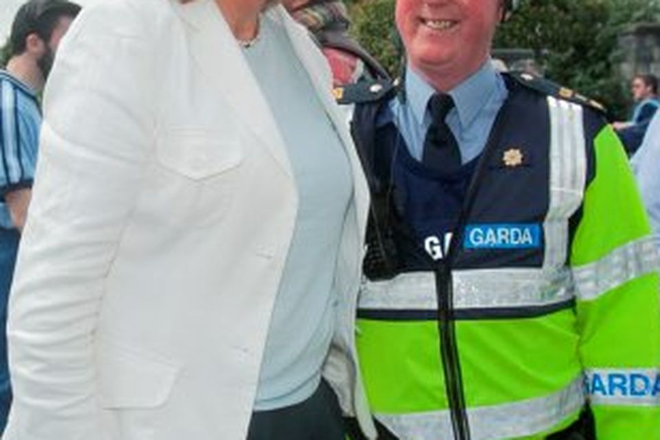 30/08/2015  
Tanaiste Joan Burton TD with Garda Jimmy Caffrey from Mountjoy Garda Station  at the GAA Semi Final between Dublin & Mayo in Croke Park, Dublin.
Photo: Gareth Chaney Collins