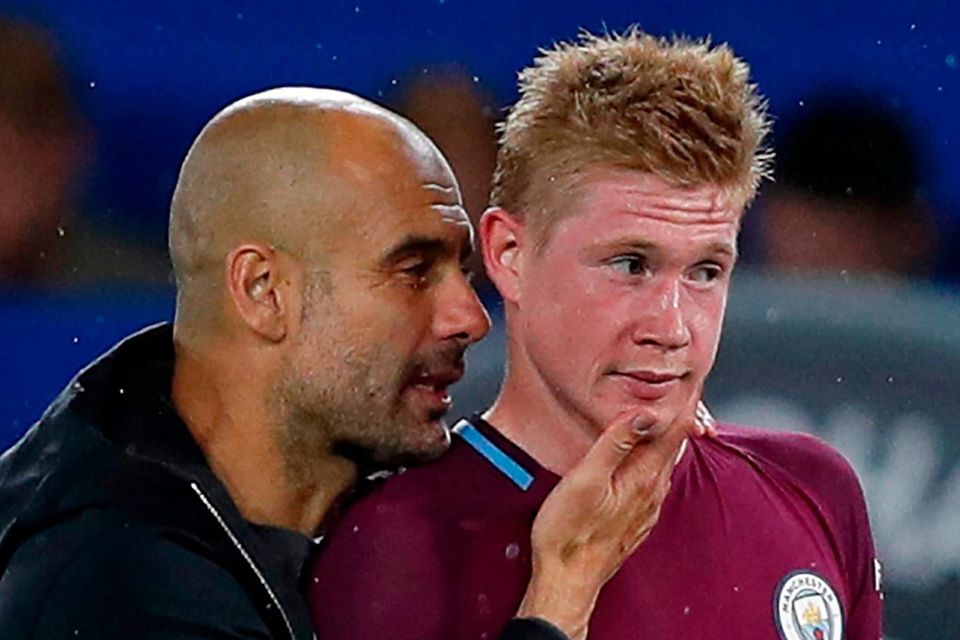 Manchester City's manager Pep Guardiola congratulates Kevin De Bruyne after the win