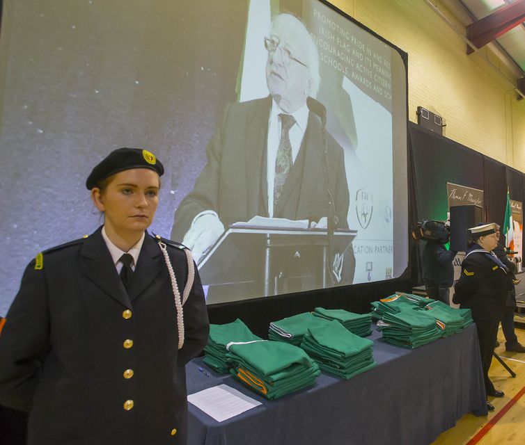 A Civil Defence member watches President Higgins address the inaugural Thomas F Meagher Foundation Schools’ Flag Presentation Ceremony. Photo: Patrick Browne