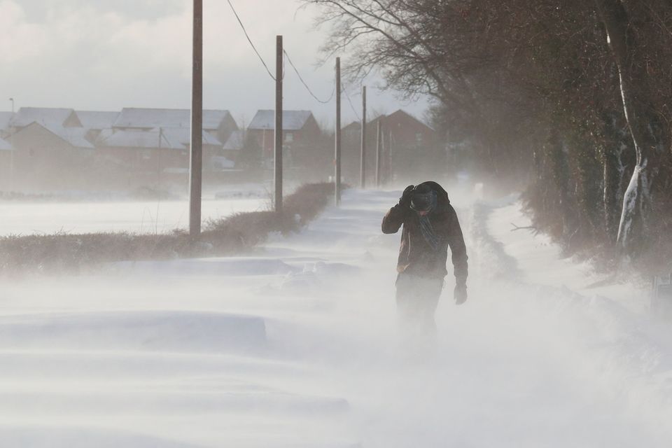 A man walking in snowy conditions in Larbert as storm Emma, rolling in from the Atlantic, looks poised to meet the Beast from the East's chilly Russia air - causing further widespread snowfall and bitter temperatures. Andrew Milligan/PA Wire