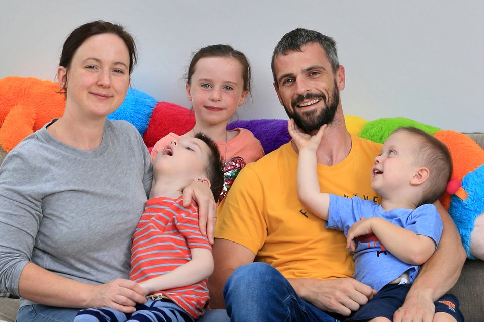 APPEAL: Lynda and Les Martin with children, Cathal (5), Holly (6) and Ciaran (3), and family dog Biscuit. Photo: Frank McGrath