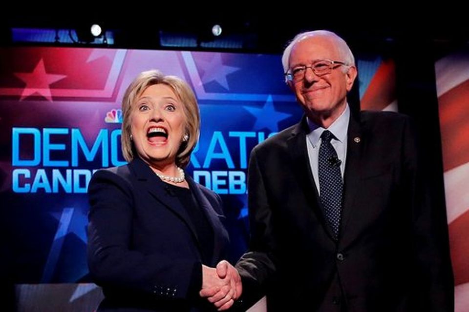 Democratic U.S. presidential candidates Hillary Clinton (L) and Bernie Sanders shake hands before the start of their presidential candidates debate sponsored by MSNBC at the University of New Hampshire in Durham, New Hampshire. Photo: Reuters