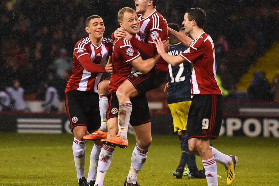 Marc McNulty celebrates with his teammates after scoring the winning goal for Sheffield United in their Capital One Cup quarter-final clash with Southampton at Bramall Lane. Photo: Shaun Botterill/Getty Images