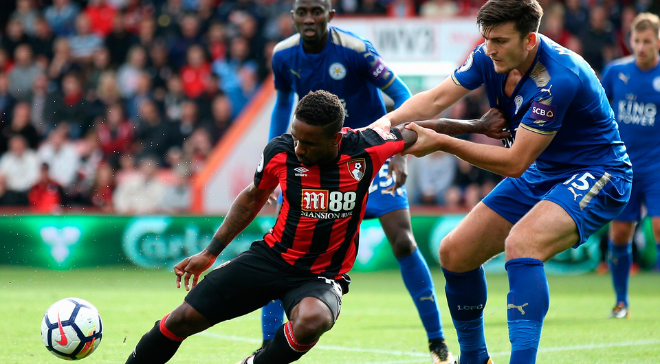 Jermain Defoe of AFC Bournemouth controls the ball under pressure from Harry Maguire of Leicester City. Photo: Getty Images
