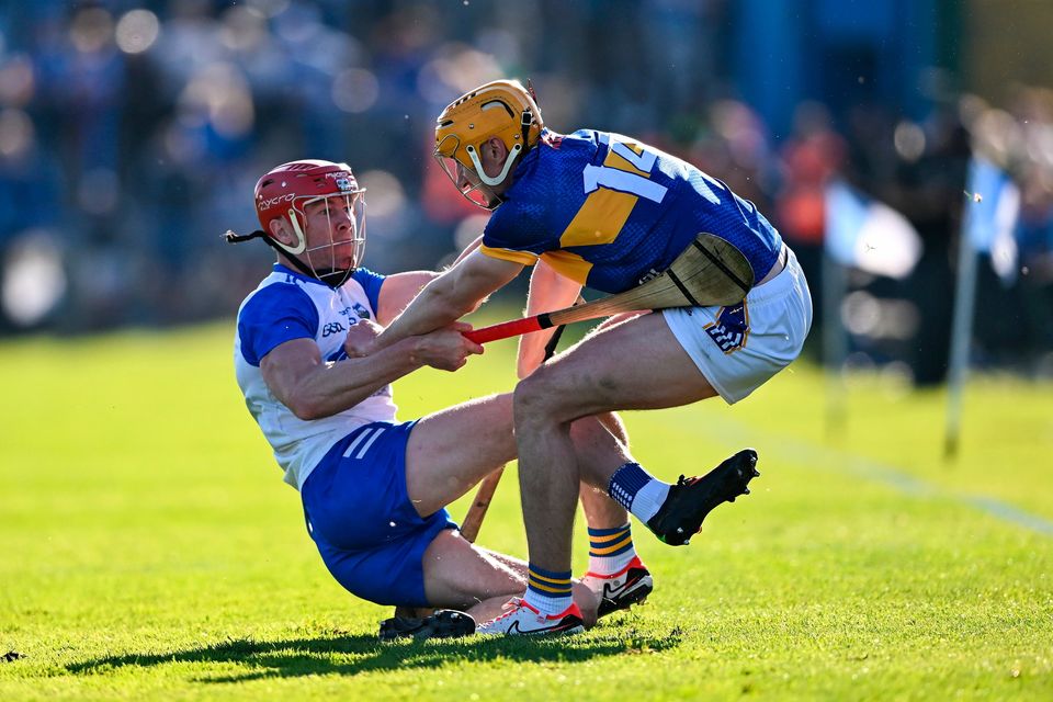 Tipperary's Mark Kehoe is tackled by Waterford's Tadhg de Búrca (left) during the Munster SHC Round 3 mat at Walsh Park in Waterford. Photo: Piaras Ó Mídheach/Sportsfile