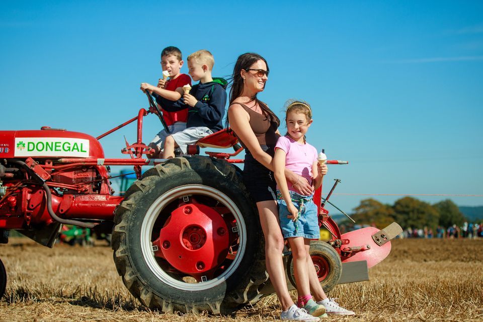 Maeve Tallon from Galway and her children Ríona (8), Iarlaith (6) and Seán (5) enjoying day two of  the National Ploughing Championships in Ratheniska. Pic: Mark Condren