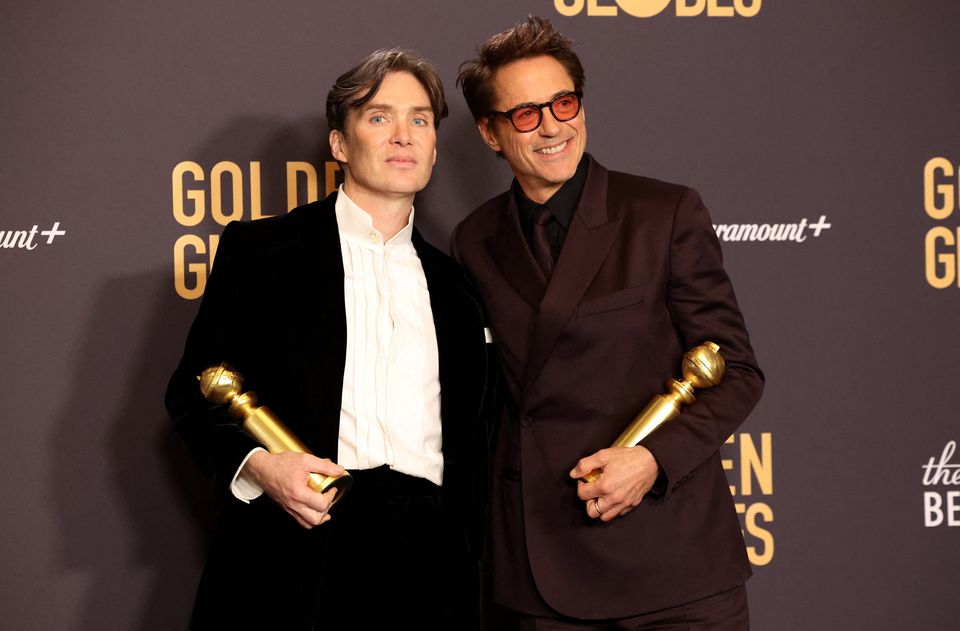 Robert Downey Jr. poses with the award for Best Motion Picture - Drama for "Oppenheimer" as Cillian Murphy holds the award for Best Performance by a Male Actor in a Motion Picture for "Oppenheimer" at the 81st Annual Golden Globe Awards in Beverly Hills, California, U.S., January 7, 2024. REUTERS/Mario Anzuoni