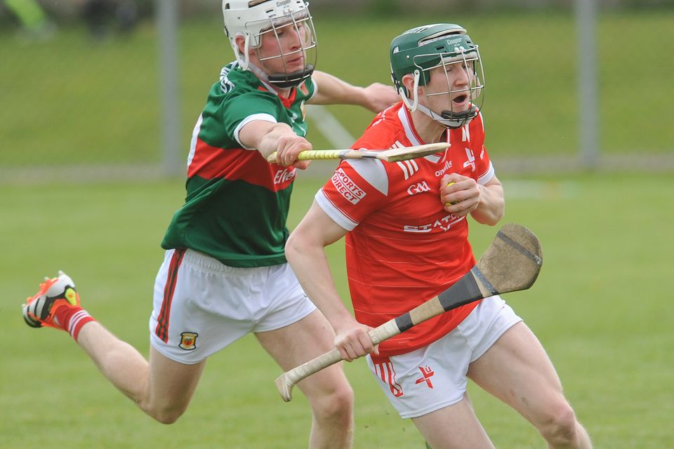 Louth's Stephen Kettle is challenged by John Heraty of Mayo during the Nicky Rackard Cup clash at St Brigid's Park, Dowdallshill. Picture: Aidan Dullaghan/Newspics