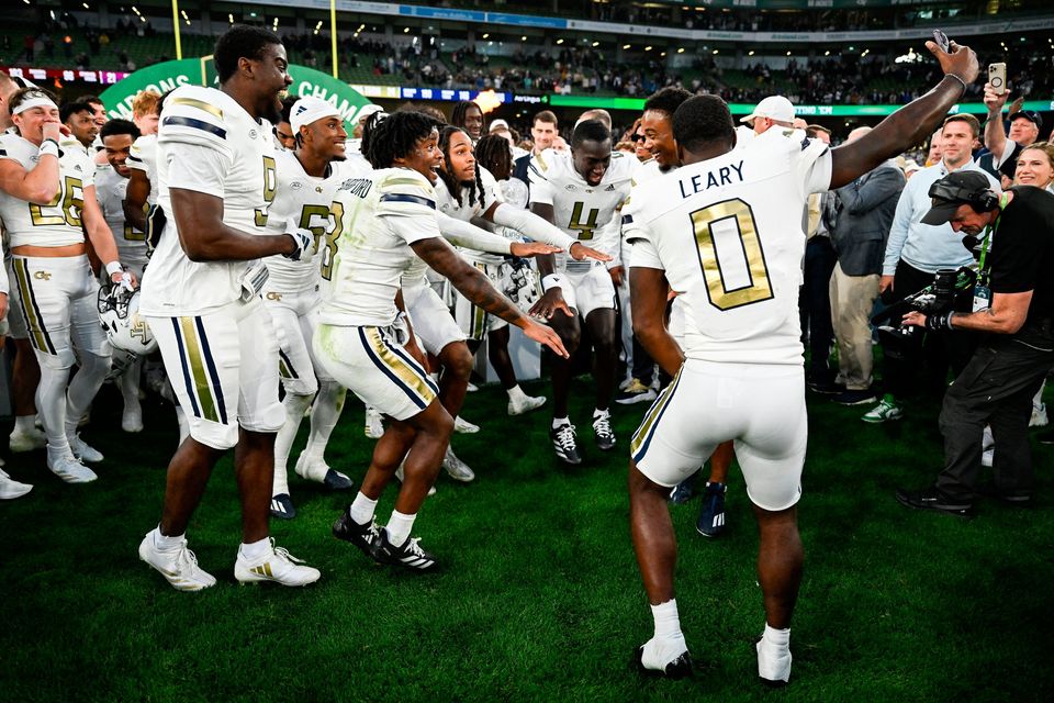 24 August 2024; Georgia Tech players celebrate after the 2024 Aer Lingus College Football Classic match between Florida State and Georgia Tech at Aviva Stadium in Dublin. Photo by Brendan Moran/Sportsfile 