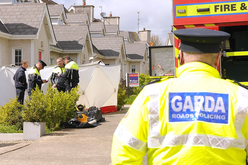 Gardaí outside a house in Mill Park where the woman's body was discovered on Tuesday morning. Photo: Jim Campbell