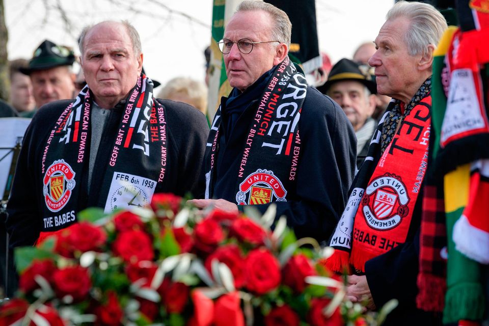 Bayern Munich's President Uli Hoeness, CEO Karl-Heinz Rummenigge and former Bavarian politician Hermann Memmel, from left, attend a commemoration ceremony on the Manchester place at the Munich Riem airport, southern Germany, Tuesday, Feb. 6, 2018. Sixty years ago on Feb. 6, 1958 a plane with professional players of the Manchester United soccer club on board crashed in Munich with 21 survivors and 23 fatalities. (Matthias Balk/dpa via AP)