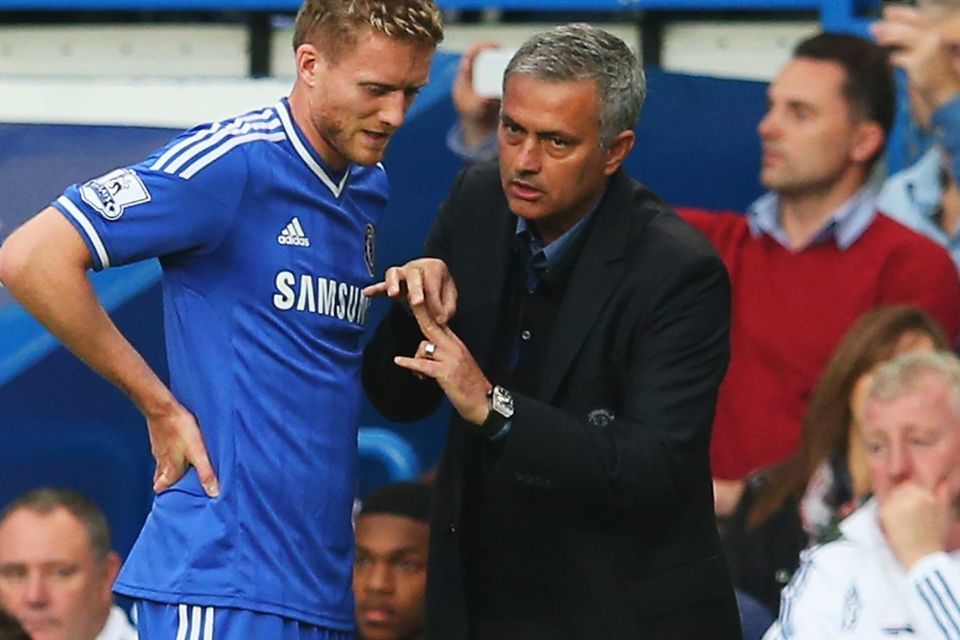 Chelsea's Andre Schurrle talks with his manager Jose Mourinho