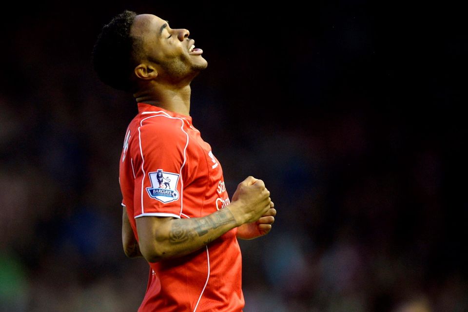 Liverpool's Raheem Sterling celebrates scoring his side's first goal of the game during the Barclays Premier League match at Anfield, Liverpool. PRESS ASSOCIATION Photo. Picture date: Monday April 13, 2015. See PA story SOCCER Liverpool. Photo credit should read: Martin Rickett/PA Wire. Editorial use only. Maximum 45 images during a match. No video emulation or promotion as 'live'. No use in games, competitions, merchandise, betting or single club/player services. No use with unofficial audio, video, data, fixtures or club/league logos.