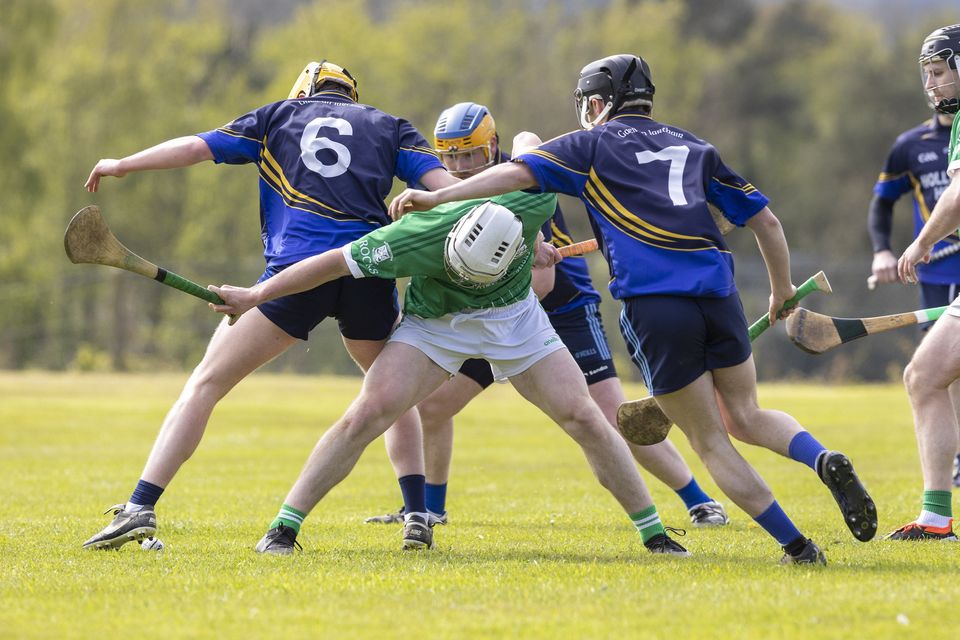 The Western Gaels half-back line surround Liam Somers of Arklow Rocks.