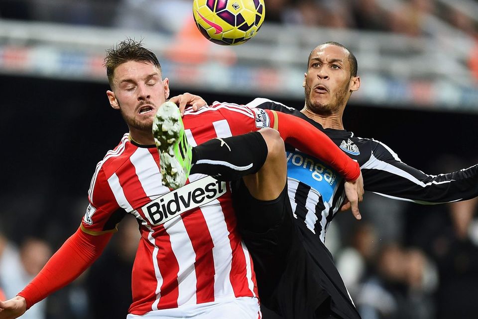 Sunderland striker Connor Wickham is challenged by Newcastle United's Yoan Gouffran during their Premier League clash at St James' Park. Photo: Laurence Griffiths/Getty Images
